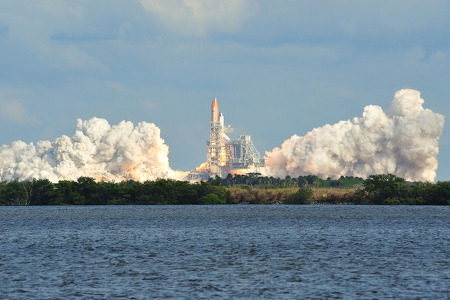 kennedy space shuttle launching with tons of smoke