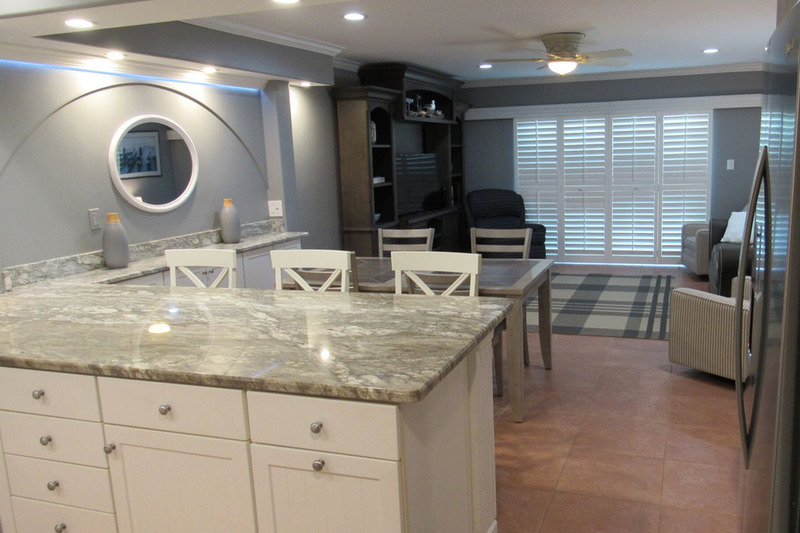 Open kitchen with granite countertop and seating