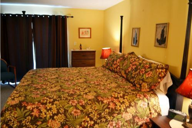 large king size bed with flower covered comforter