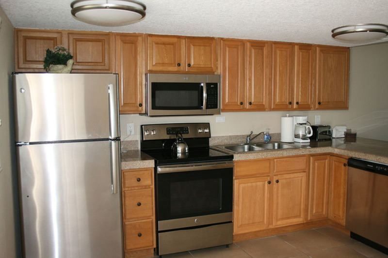 close up kitchen view with wood cabinets 