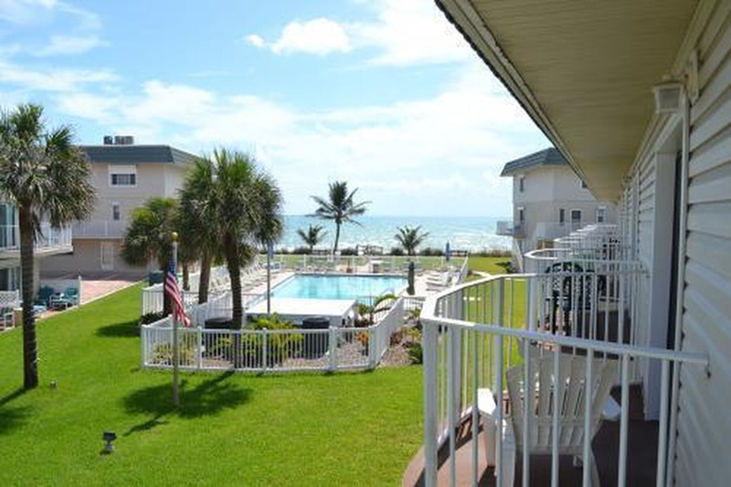 view of the pool and ocean from the balcony on the second floor