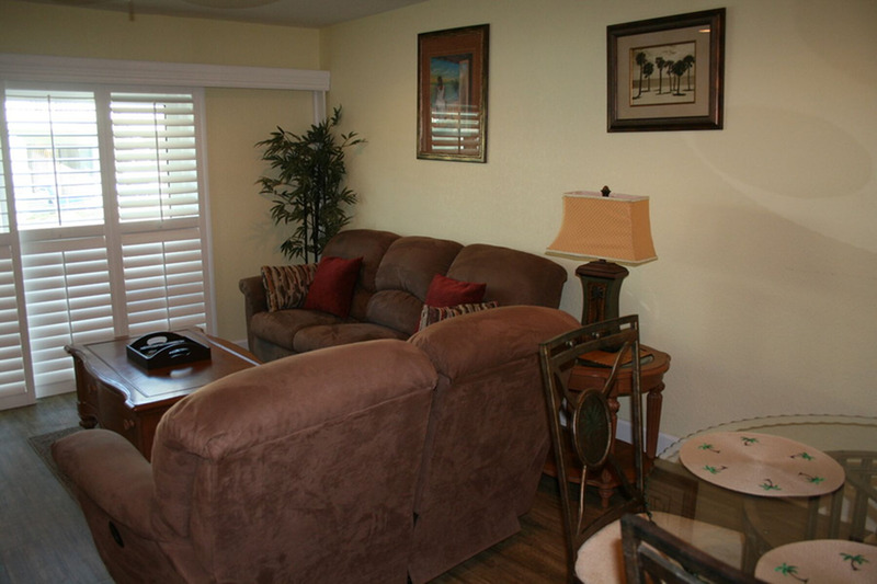 two reddish brown couches in an L formation