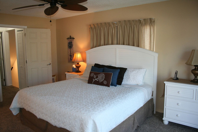 large white king size bed in master bedroom