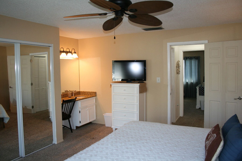large white king size bed in master bedroom