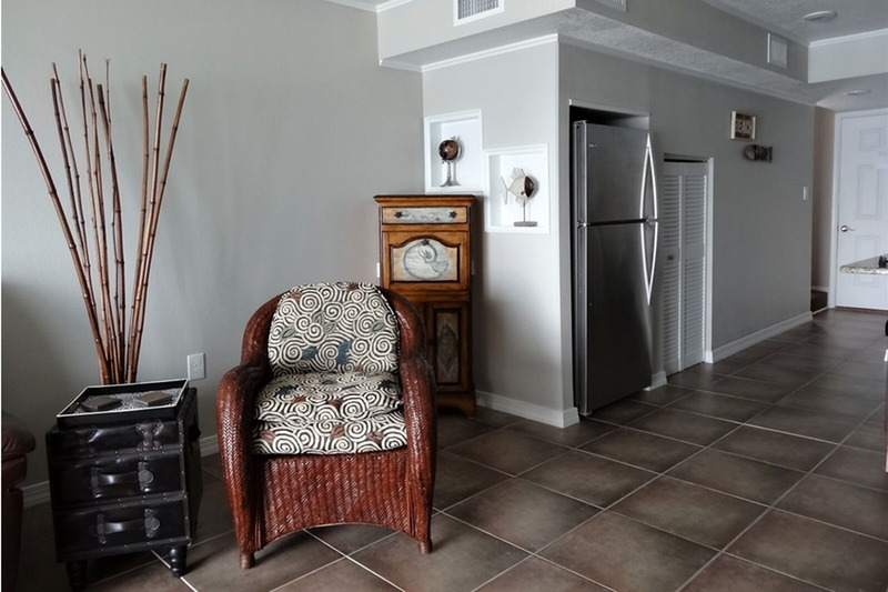 chair with a bamboo plant next to it