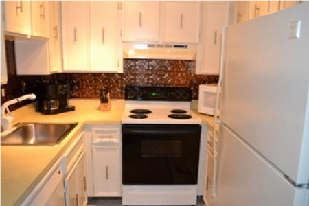 small kitchen with yellow countertops
