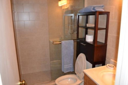 bathroom with walk in shower and glass doors