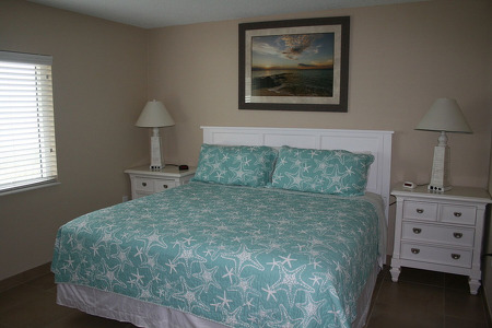 Master Bedroom with King Bed, Two Night Stands, and a TV