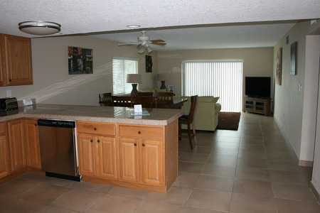 kitchen view with a living room in the back