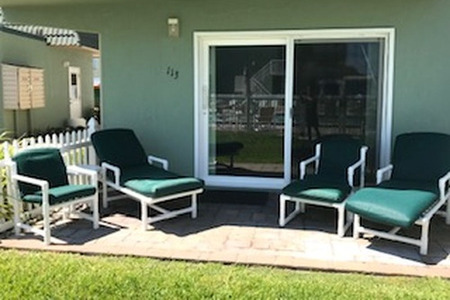 outside view of four chairs on a patio