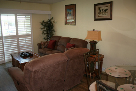 two reddish brown couches in an L formation