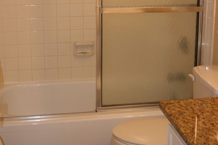 bathroom with two in one tub and shower