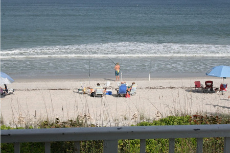 balcony view of people fishing on the beach