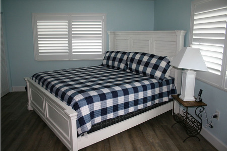 white and blue checkered master bed
