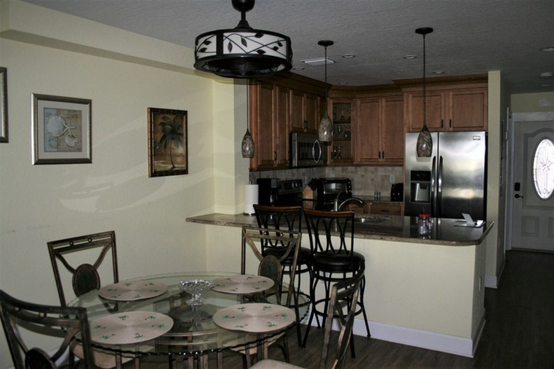 black and dark wood colored kitchen and dining area