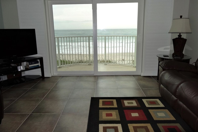 view of the ocean from the sliding glass door