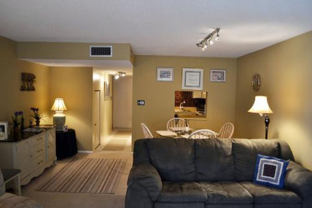 yellow encapsulated room with a dining area and living area